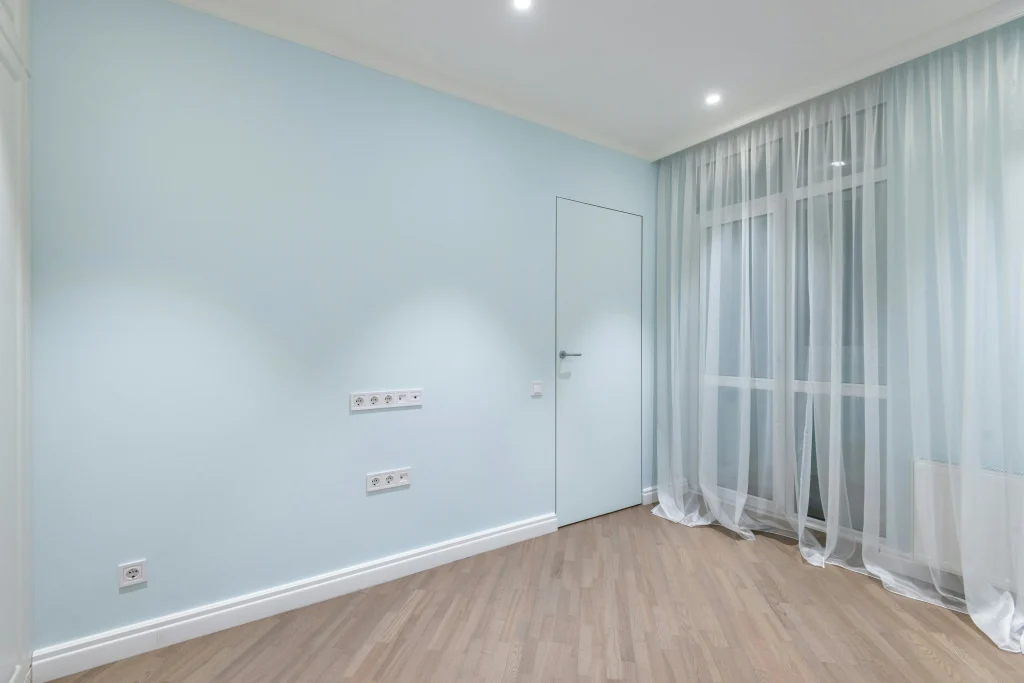 Empty modern room in Horry County, South Carolina with clean walls, natural light, and open floor space