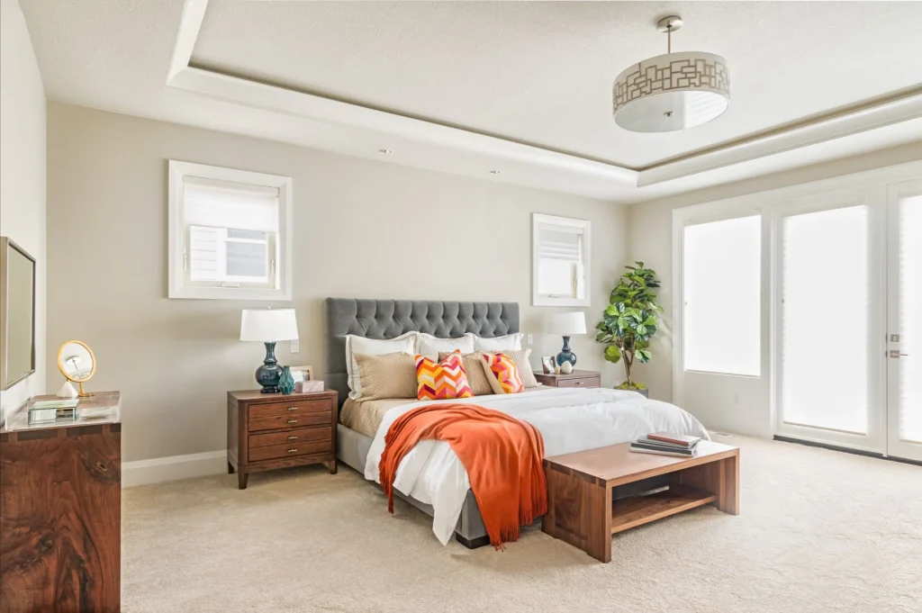 Modern bedroom interior design in Horry County, South Carolina featuring a bright, elegant space with stylish furnishings, soft neutral tones, layered textures, and a calm, upscale coastal-inspired atmosphere.
